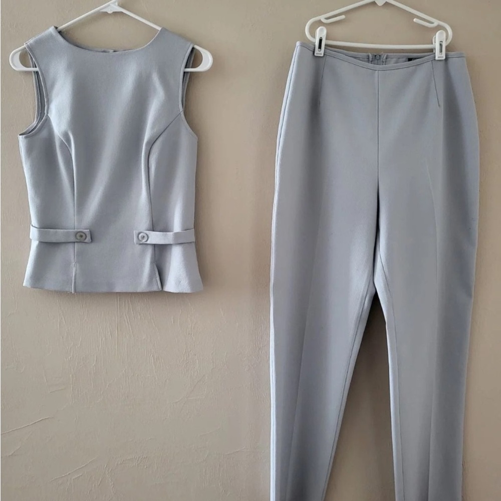 Gray 2 piece, top buttons in back,  pants zips on back.  All sales are final.